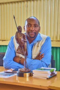 Alexander-Nderitu-at-Karatina-University-with-his-Top-40-Under-40-Trophy-asian-literary-festival 
