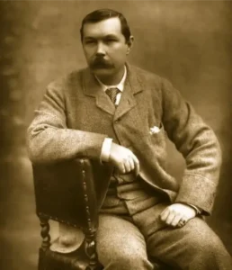 sherlock holmes Photograph of Arthur Conan Doyle, seated sideways on chair. Published in "Men and Women of the Day 1893", Eglington & Co., England, 1893.