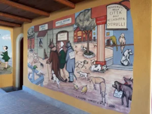 Pinocchio nella città di Acchiappacitrulli in uno dei murales di Vernante.