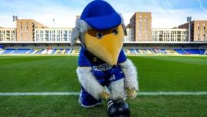 Haydon the Womble, the mascot of AFC Wimbledon football club, is taking on the London Marathon on 26 April 2026.
