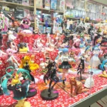 be comics be games xmas 2025, stand con action figure